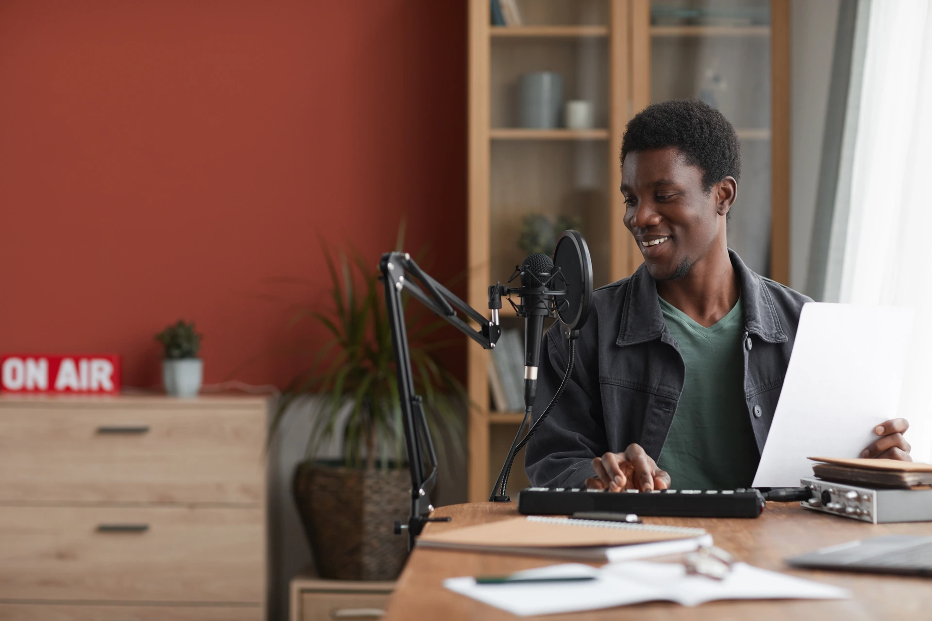 A man recording his voice to create a digital clone with Altered Voice Cloning